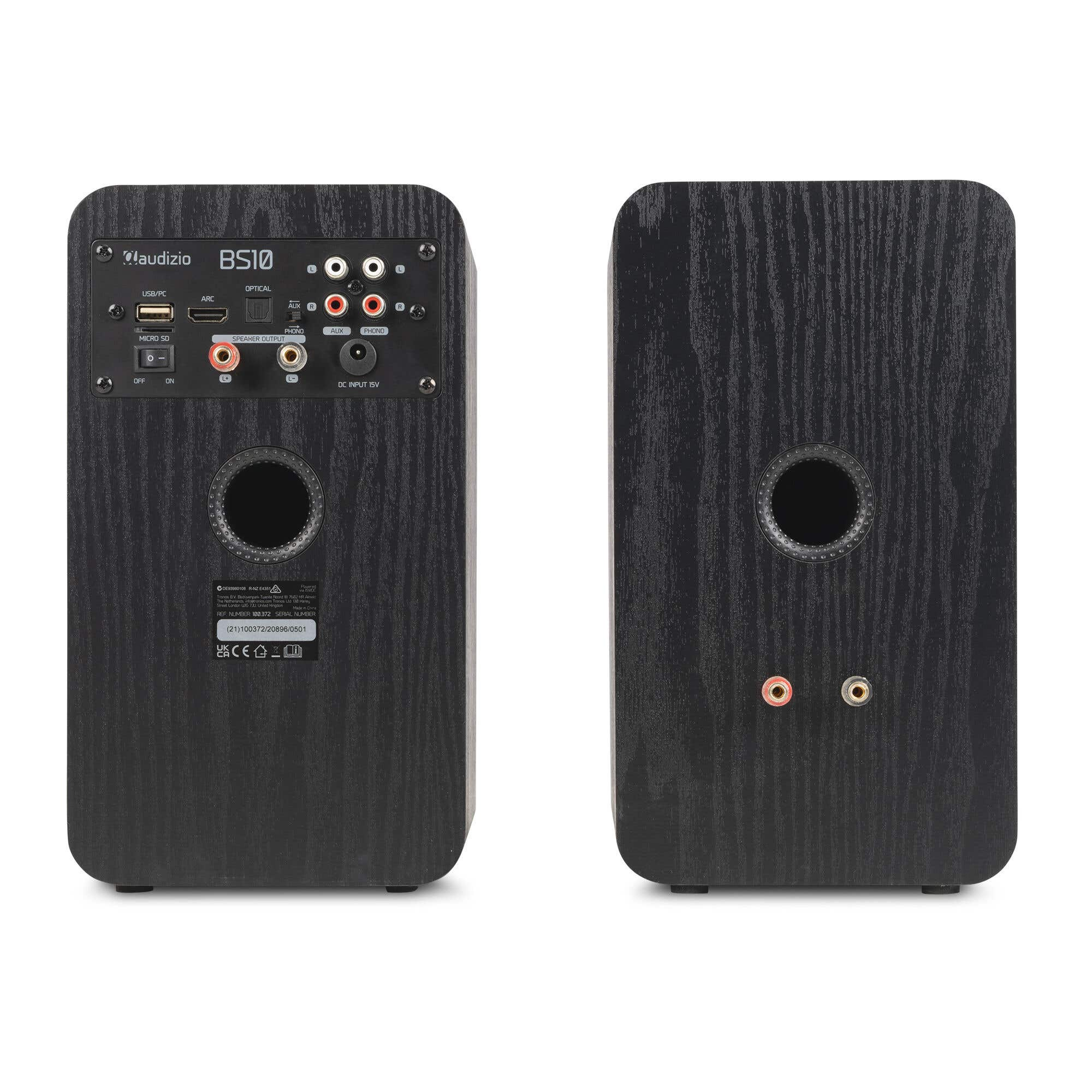 Parte trasera de altavoz negro de madera con puertos: USB, ARC, Óptico, Aux, Phono.