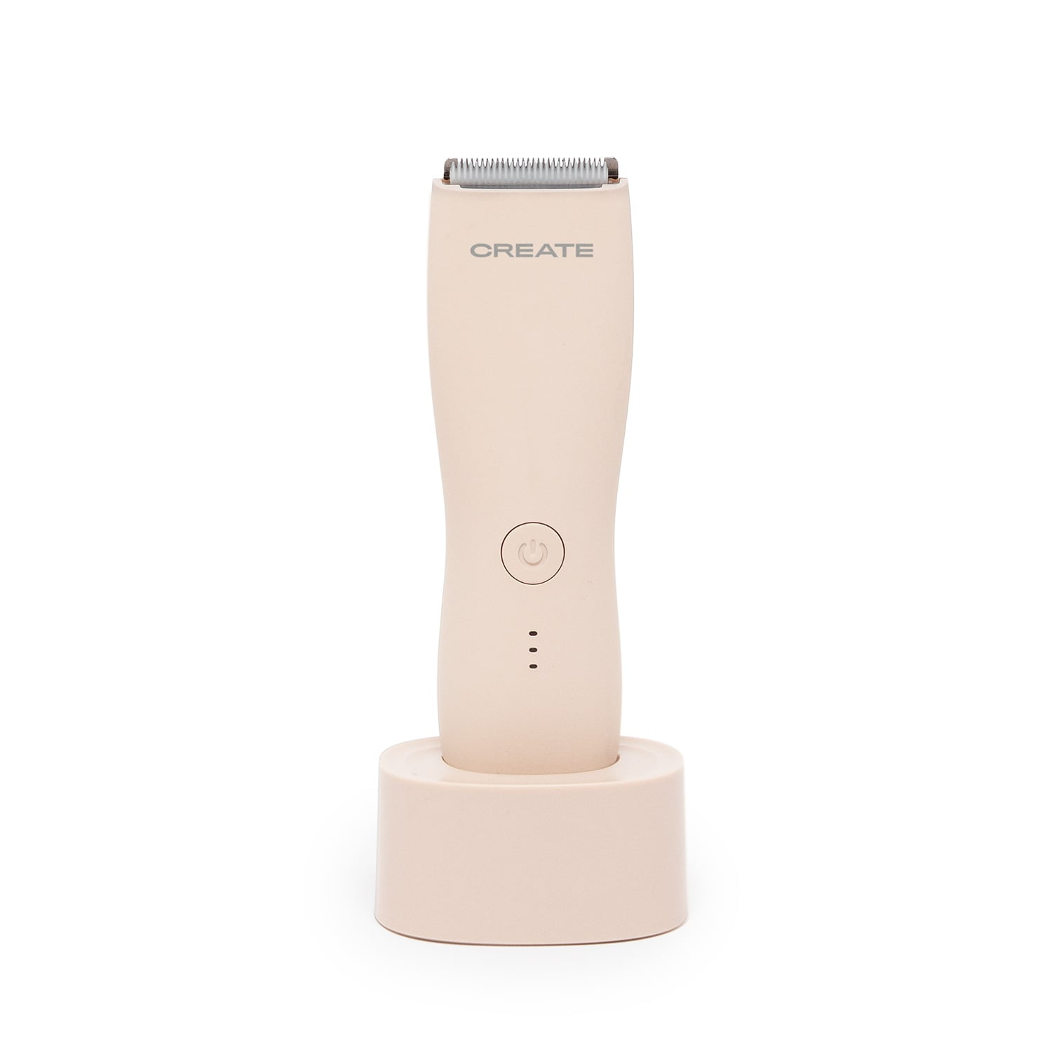 Un recortador ergonómico de color claro está sobre una base de carga.