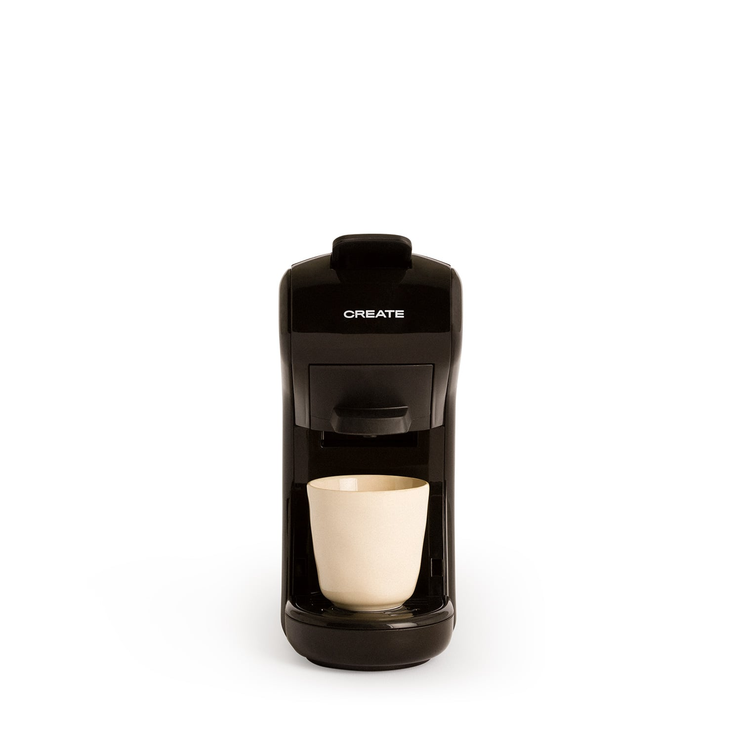 Una cafetera negra con una taza beige claro.