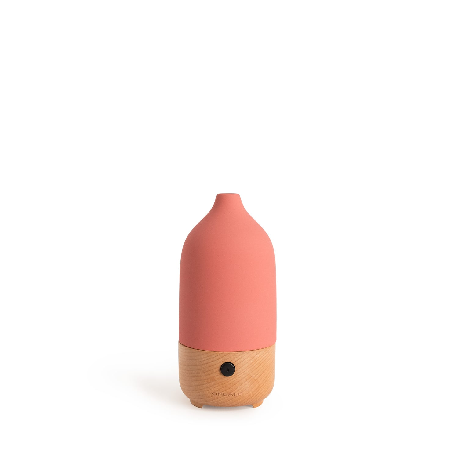 Un difusor coral con base de madera y un botón.