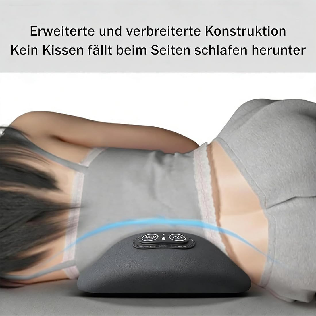 Ein graues Kissen mit Bedienelementen unter einer Person, die auf der Seite liegt.