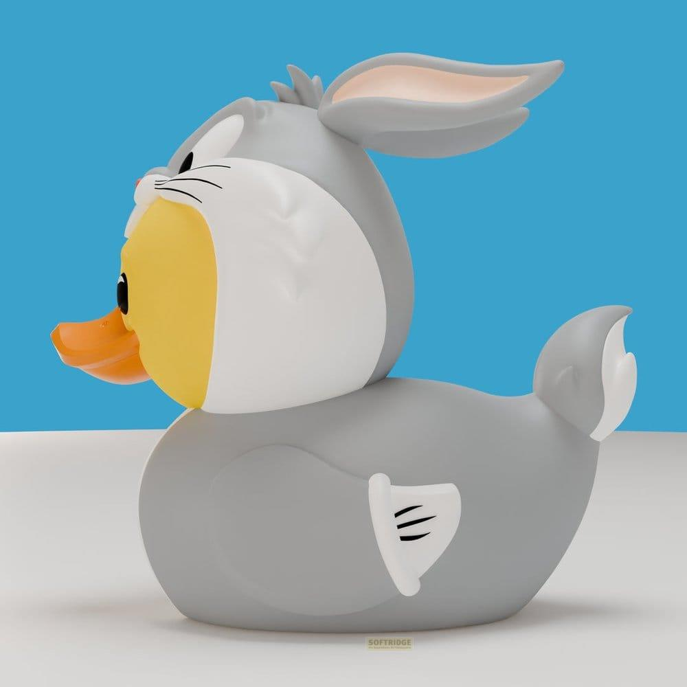 Graue Ente mit Bugs Bunny-Ohren und Schnabel, blauer Hintergrund.