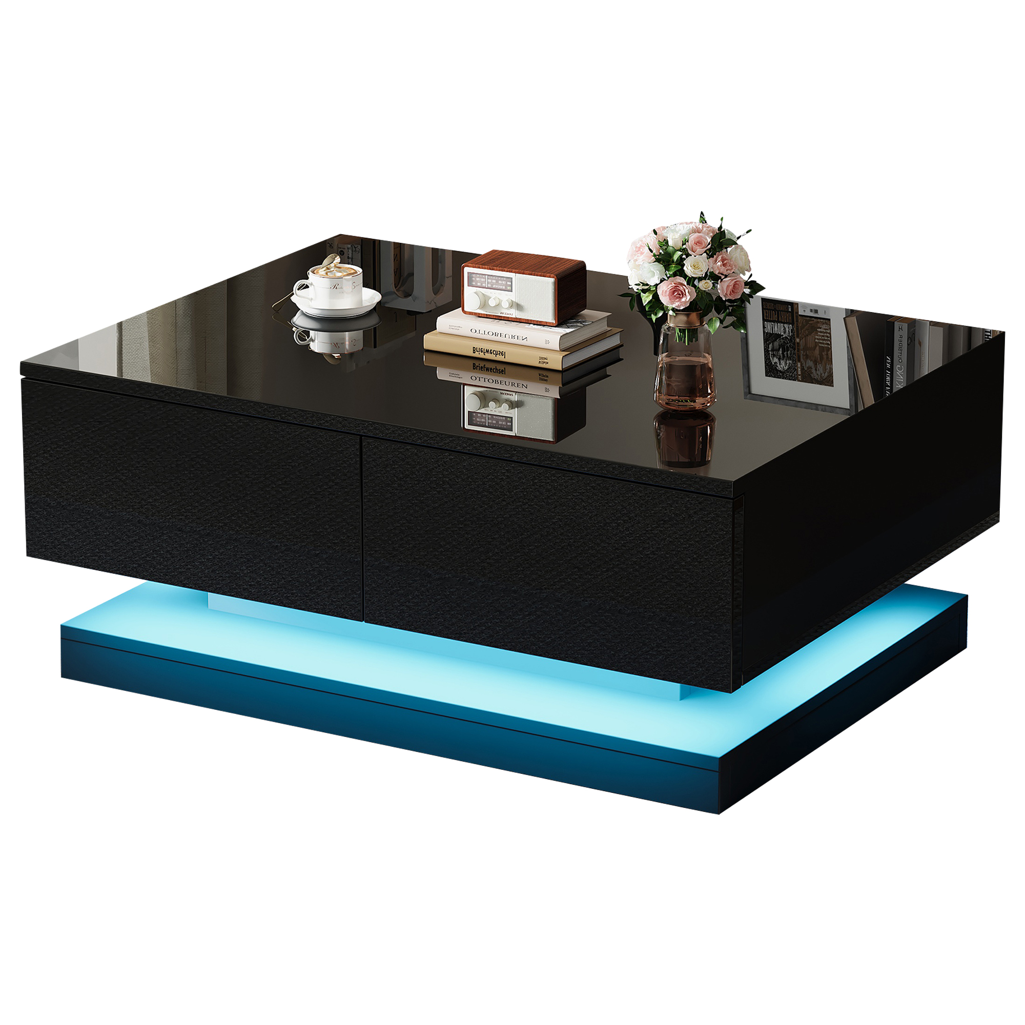 Schwarzer Couchtisch mit blau beleuchtetem Sockel, darauf Bücher, Radio, Kaffee und Blumen.