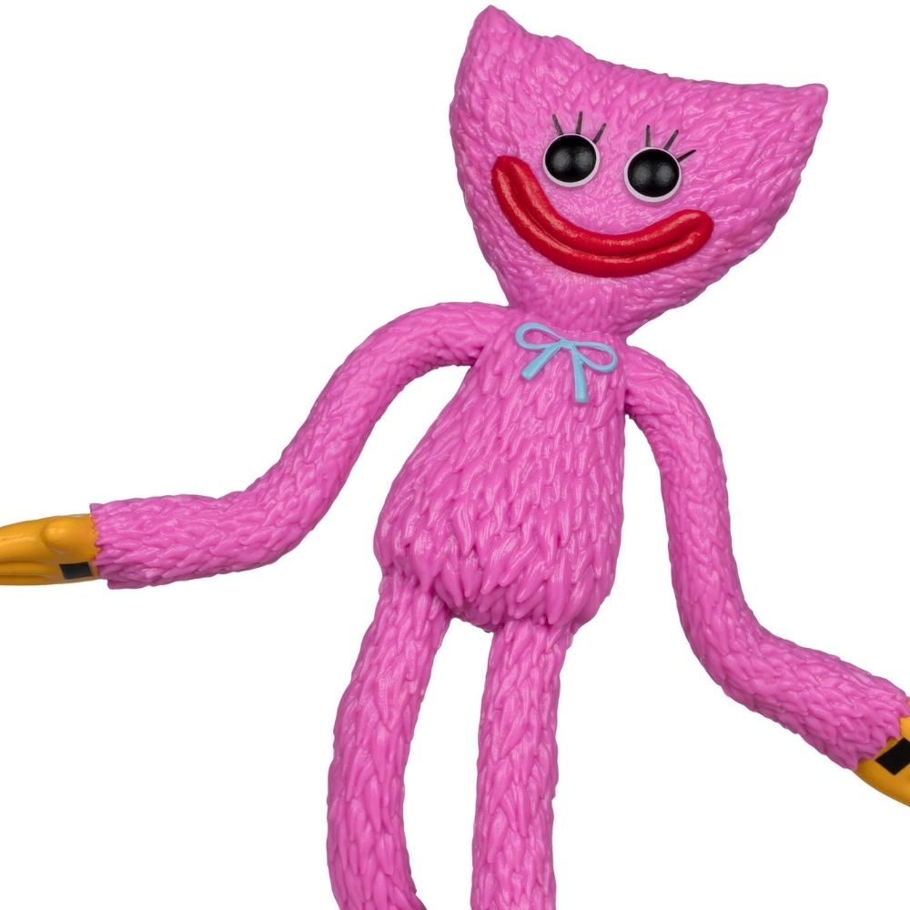 Eine flauschige pinke Figur mit großen schwarzen Augen, rotem Mund und blauer Schleife.