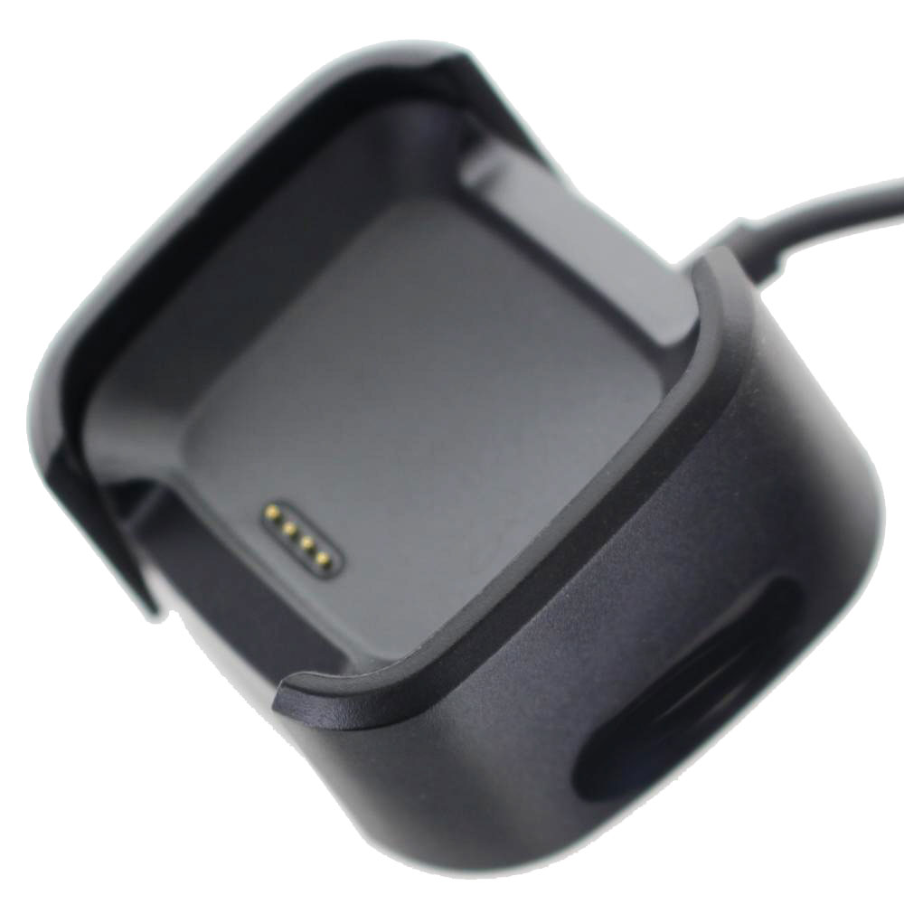 Ein schwarzes Ladegehäuse für ein Wearable mit vier goldenen Kontaktstiften.
