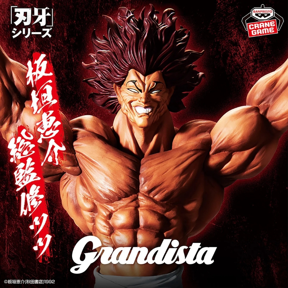 Un personaggio anime muscoloso con capelli rossi e un ampio sorriso.