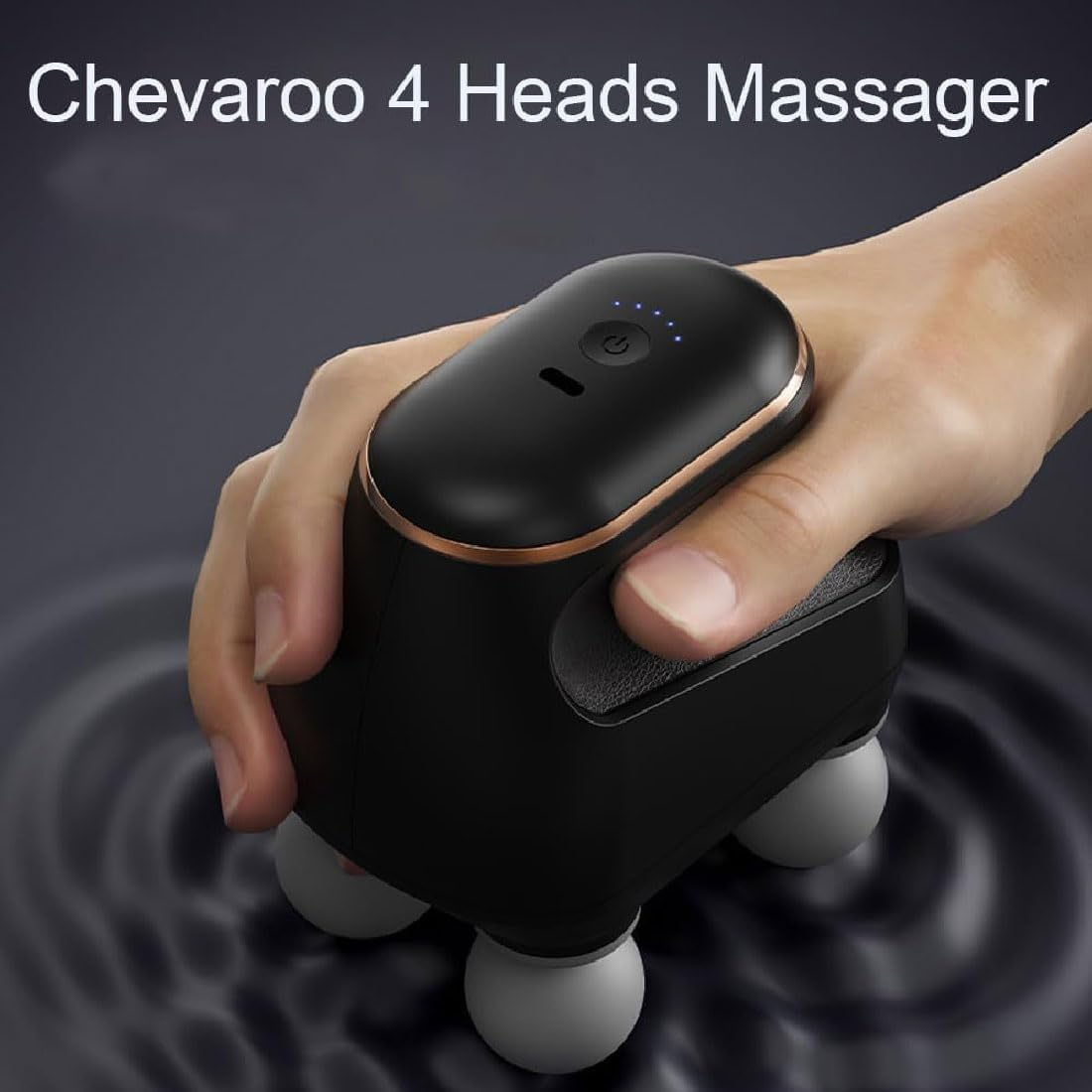 Schwarzer Handmassagegerät mit vier Kugeln, gehalten in einer Hand.