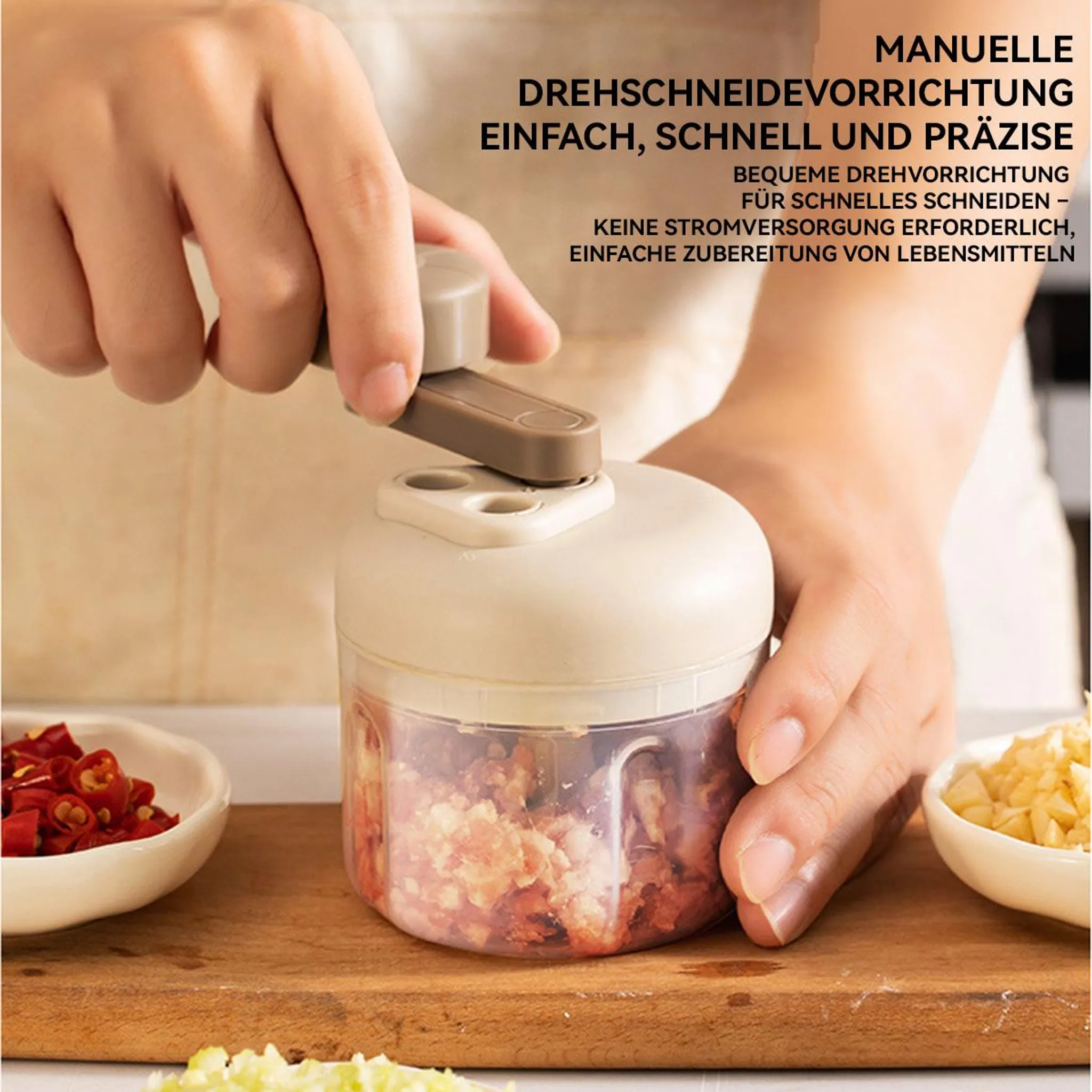 Manuelle Drehschneidevorrichtung mit Kurbel, zerkleinert Lebensmittel.