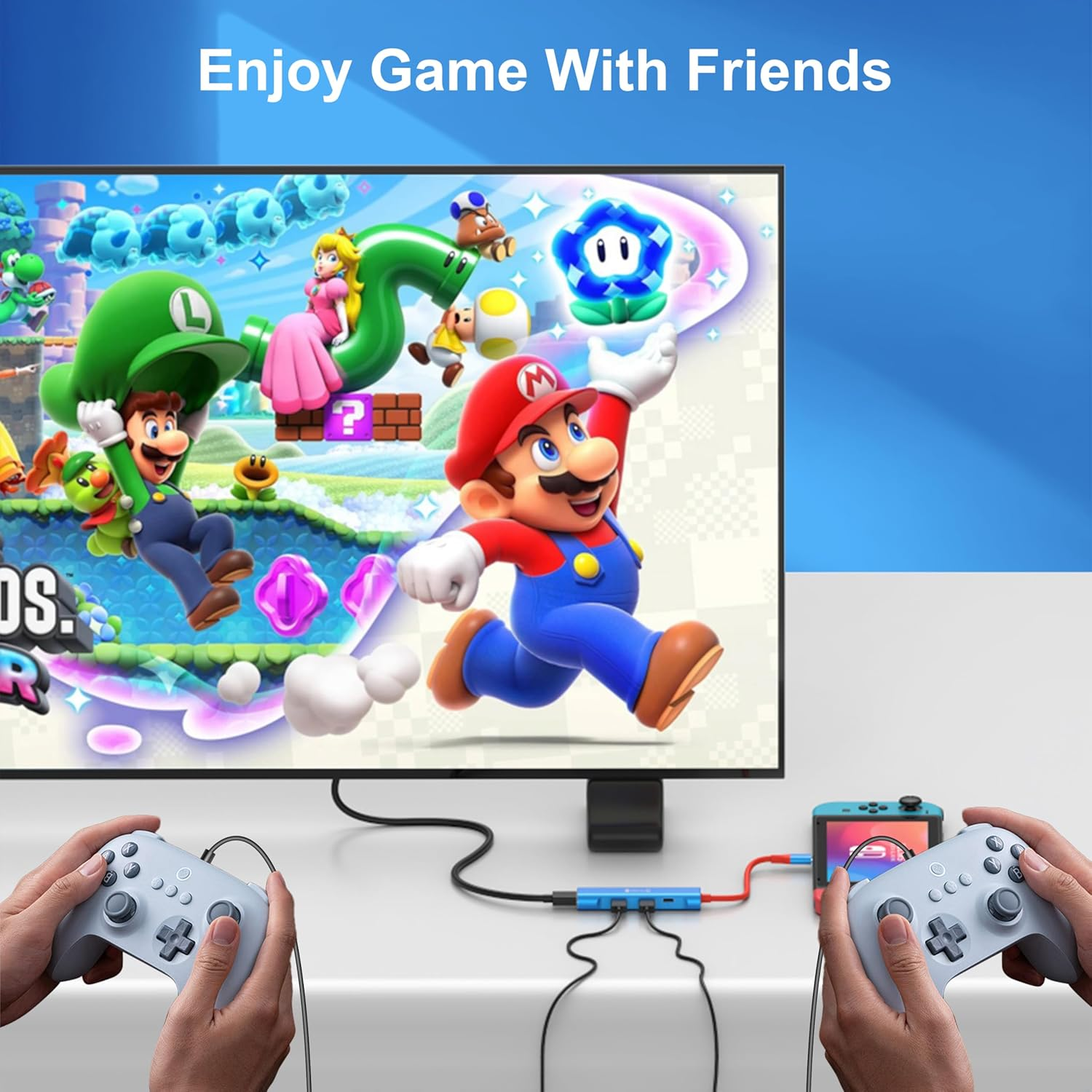 Mario und Luigi spielen ein Spiel auf einem großen Monitor, Controller sind verbunden.
