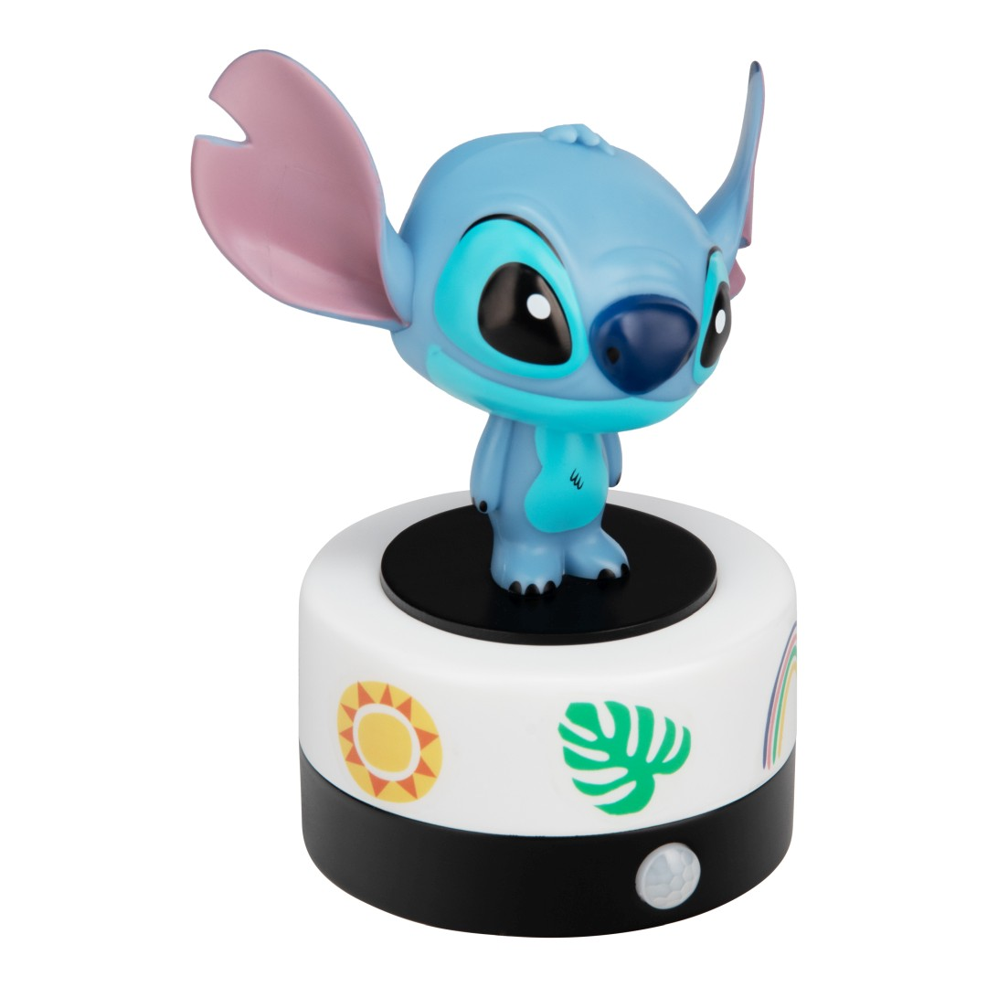 Niebieska figurka Stitch stoi na białym cylindrze z kolorowymi ikonami.
