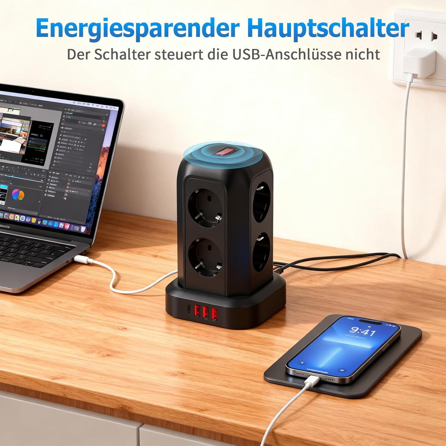 Schwarzer Steckdosenwürfel mit Laptop, Handy und Wandsteckdose.