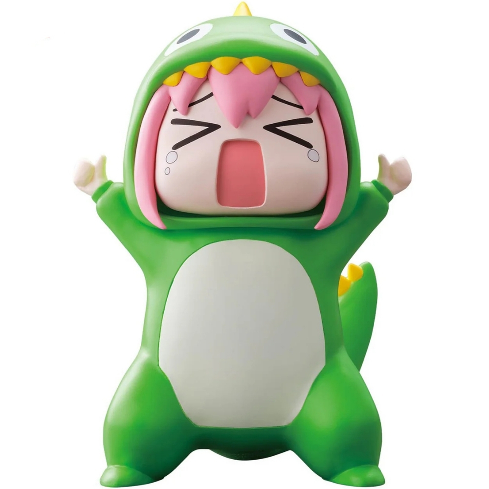 Figura in costume da dinosauro verde con capelli rosa, bocca aperta.