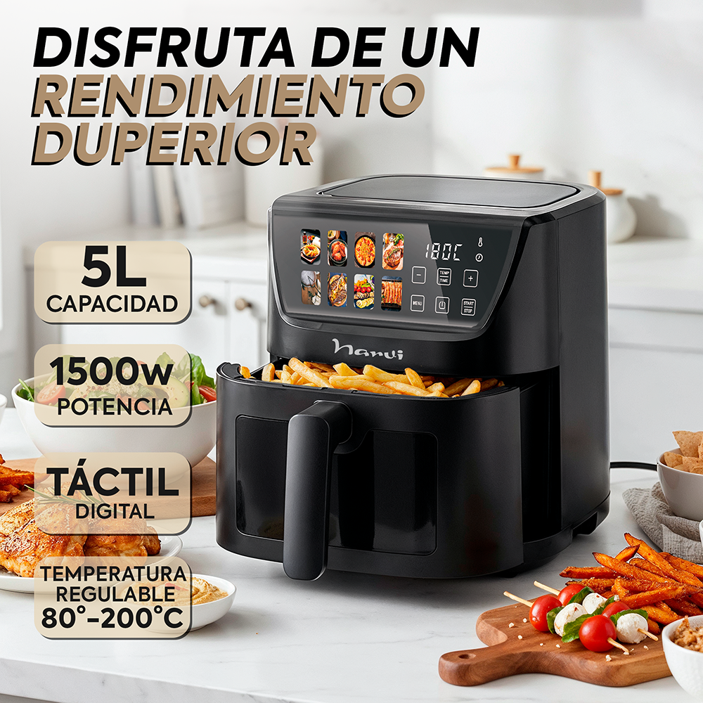 Freidora de aire negra con papas fritas y aperitivos.