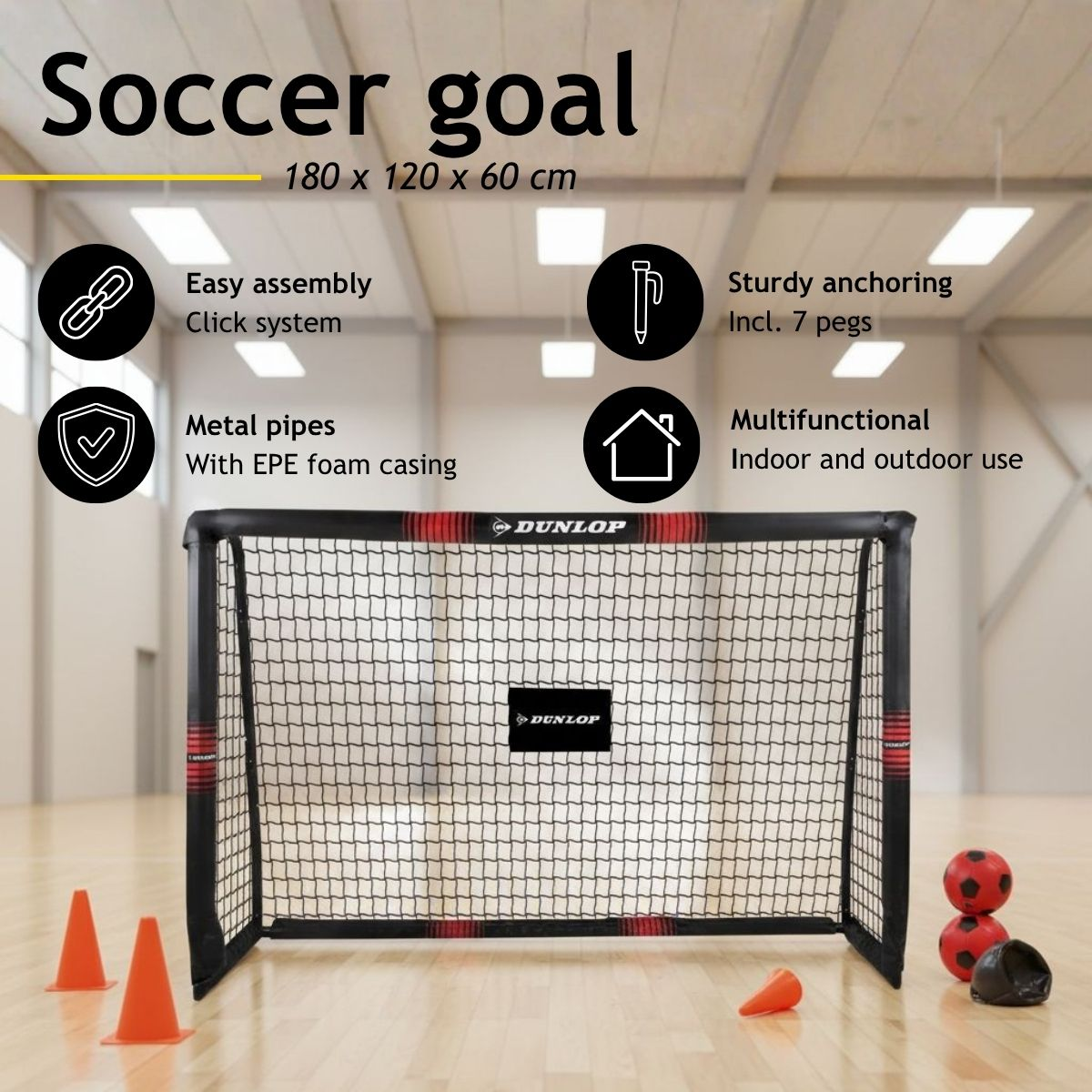 A soccer goal with net, orange cones, and soccer balls indoors.