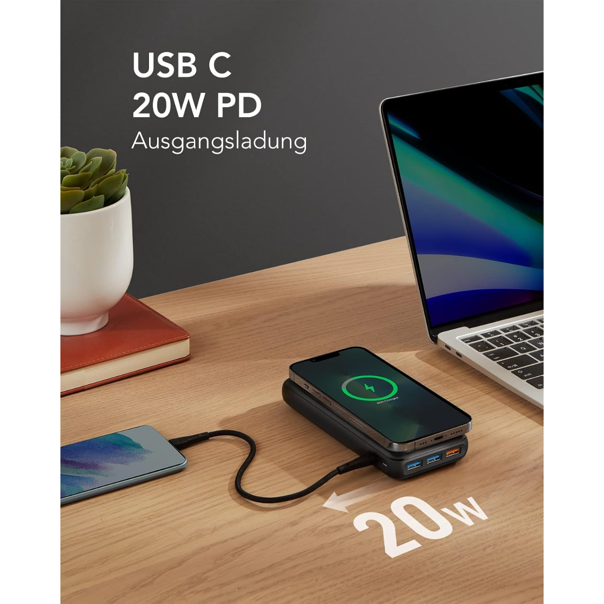 Eine Powerbank lädt ein Handy und einen Laptop. USB C 20W PD.