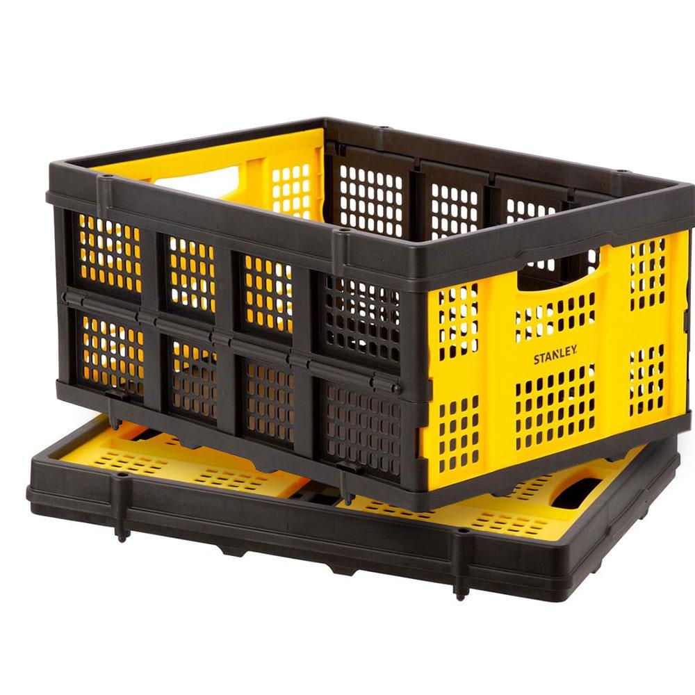 Un contenitore Stanley pieghevole giallo e nero su una base nera.