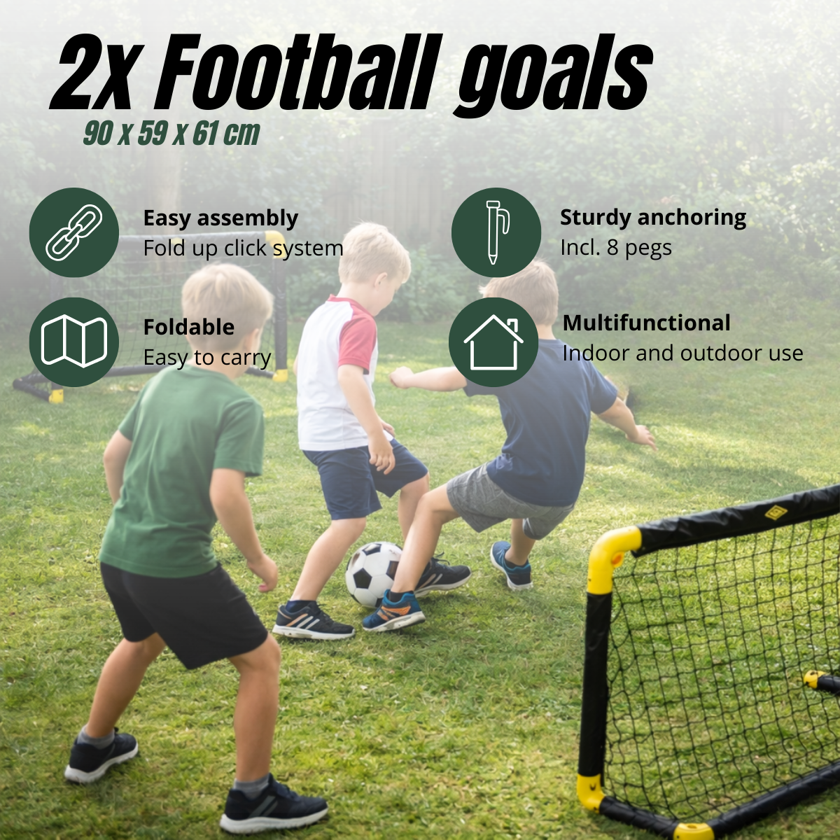 Three children play football on grass with two football goals in the background.