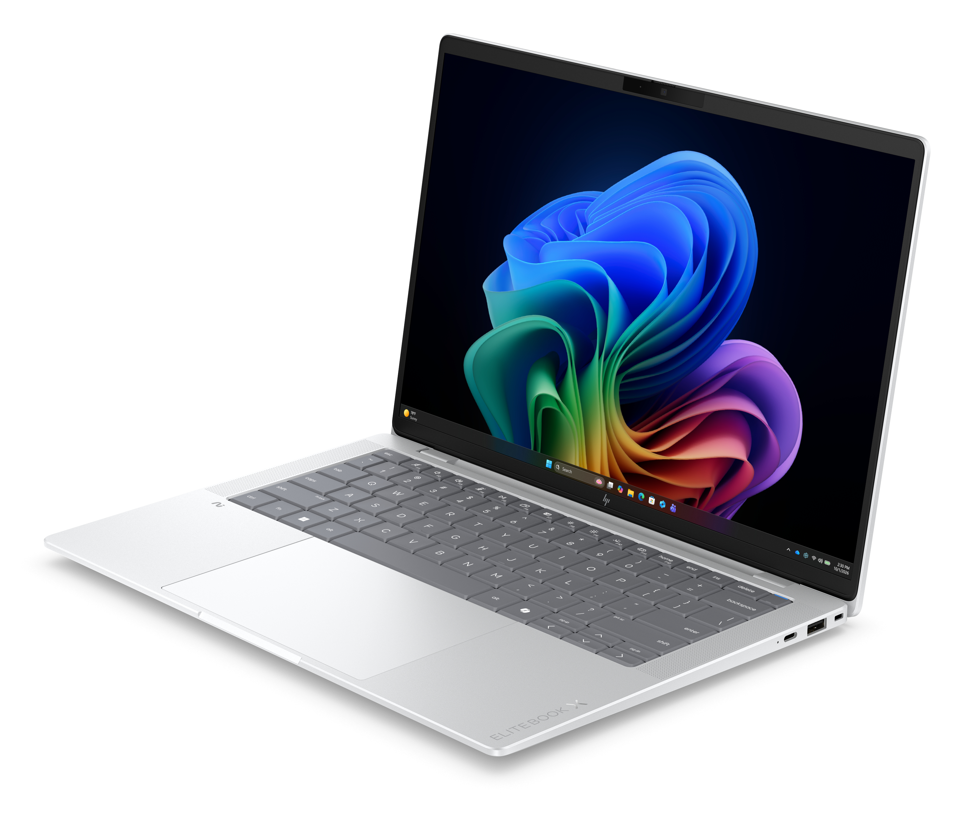 Un laptop argentato ed elegante con tastiera retroilluminata e sfondo colorato.