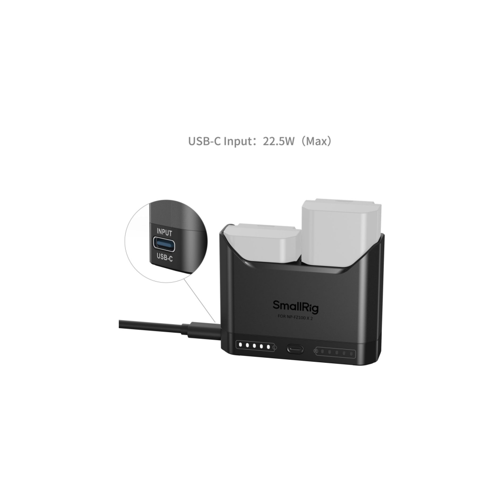 Kleiner schwarzer Ladegerät mit zwei weißen Akkus und USB-C-Anschluss.