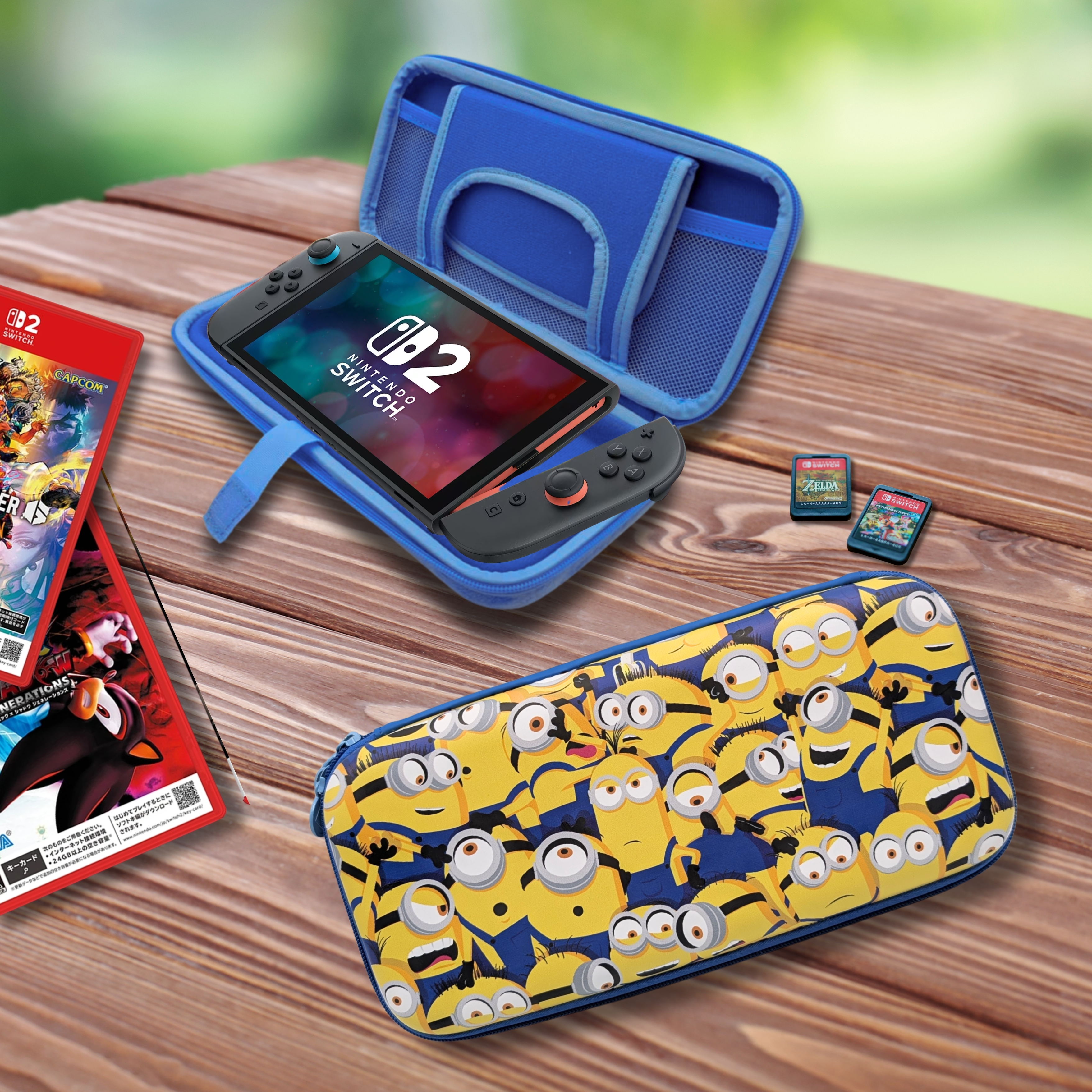 Nintendo Switch con accesorios: juegos, fundas y accesorios sobre mesa de madera.
