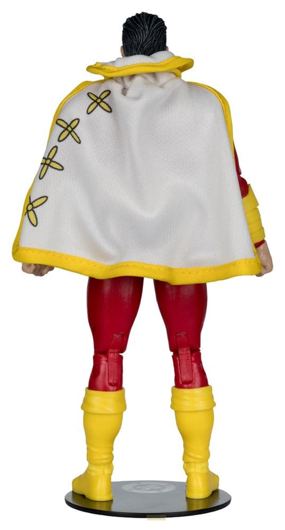 Rückansicht einer Actionfigur mit rotem Anzug, gelben Stiefeln und weißem Umhang mit gelbem Rand.