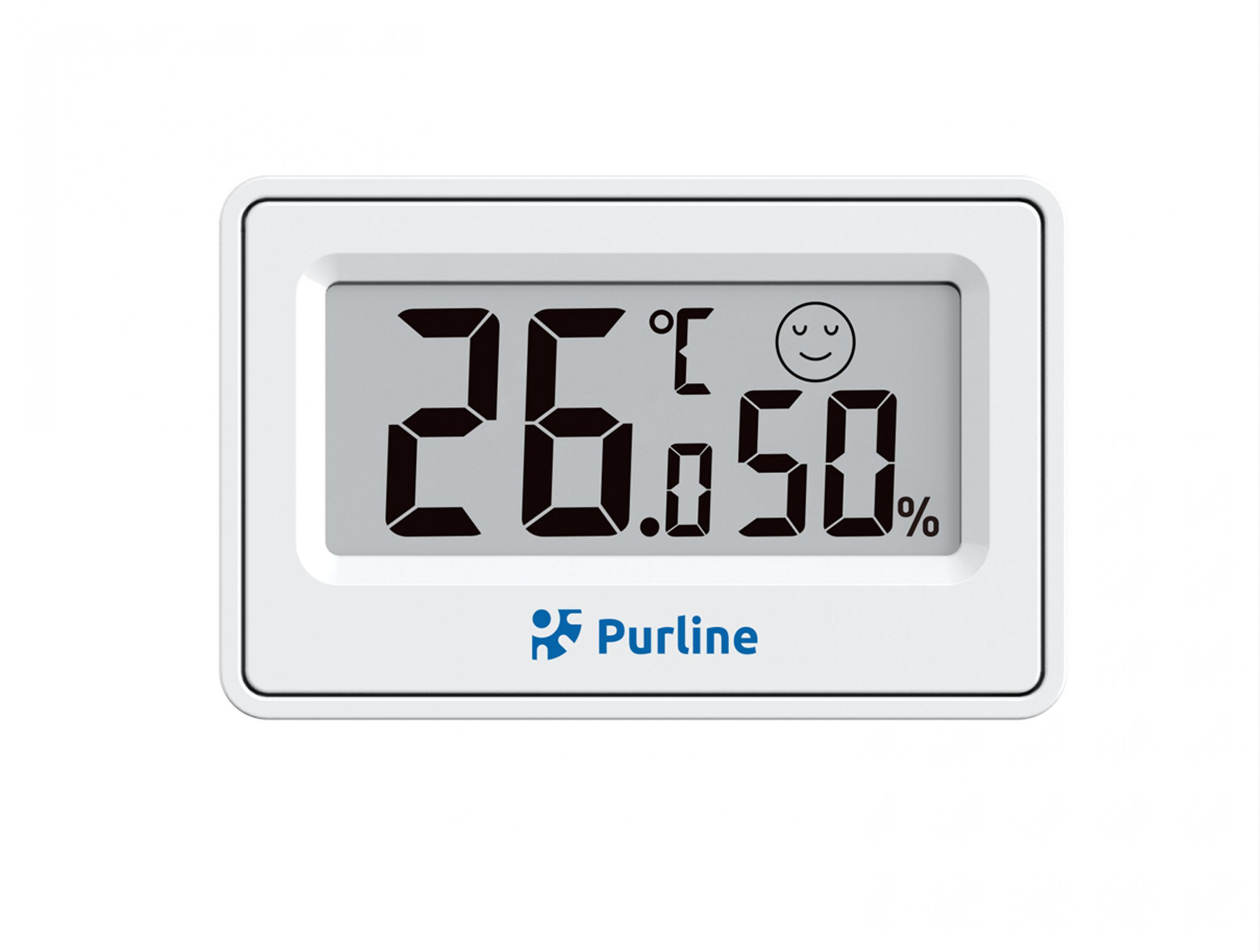 Un termómetro digital blanco muestra 26 grados Celsius y 50% de humedad.