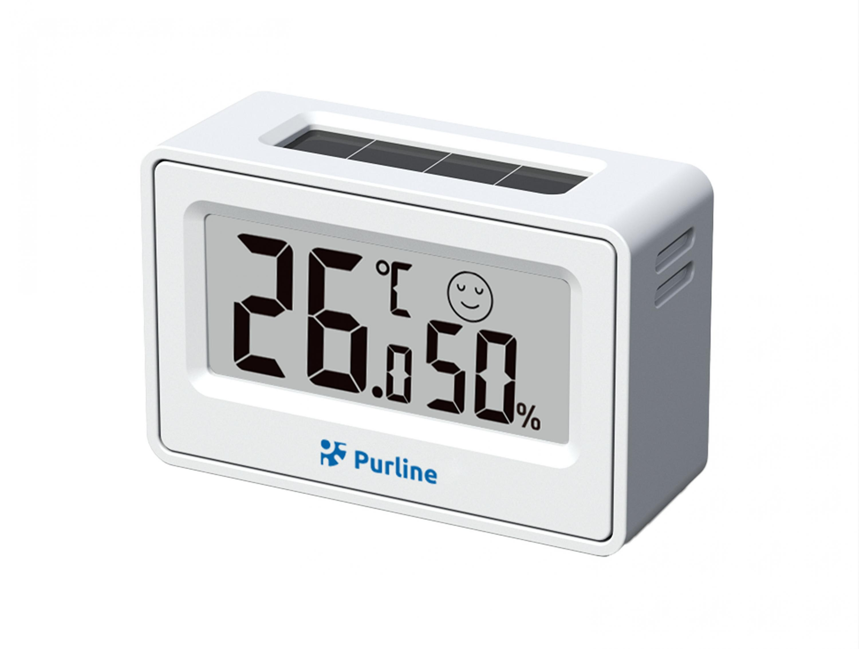 Termómetro digital blanco muestra 26.0C y 50% humedad con cara sonriente.