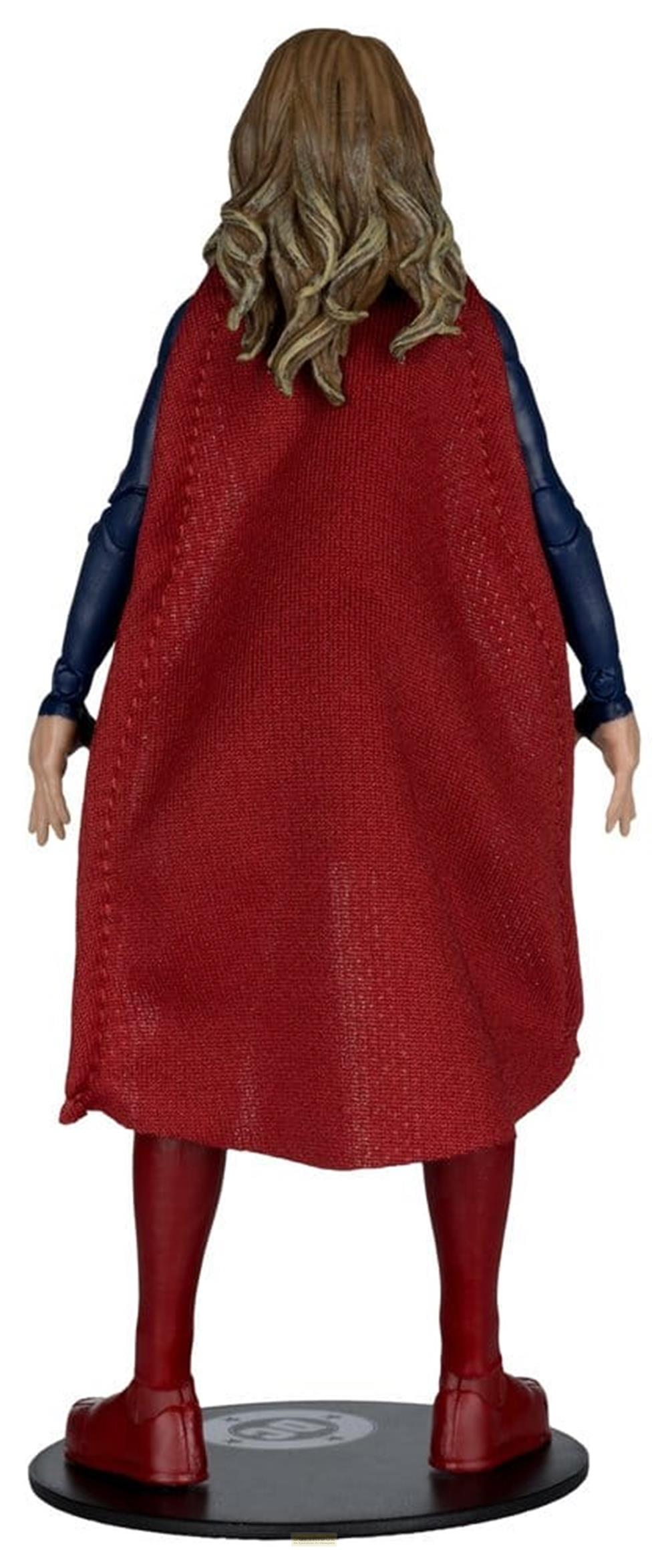 Rückansicht einer Actionfigur mit rotem Umhang, blauer Kleidung und blonden Haaren.
