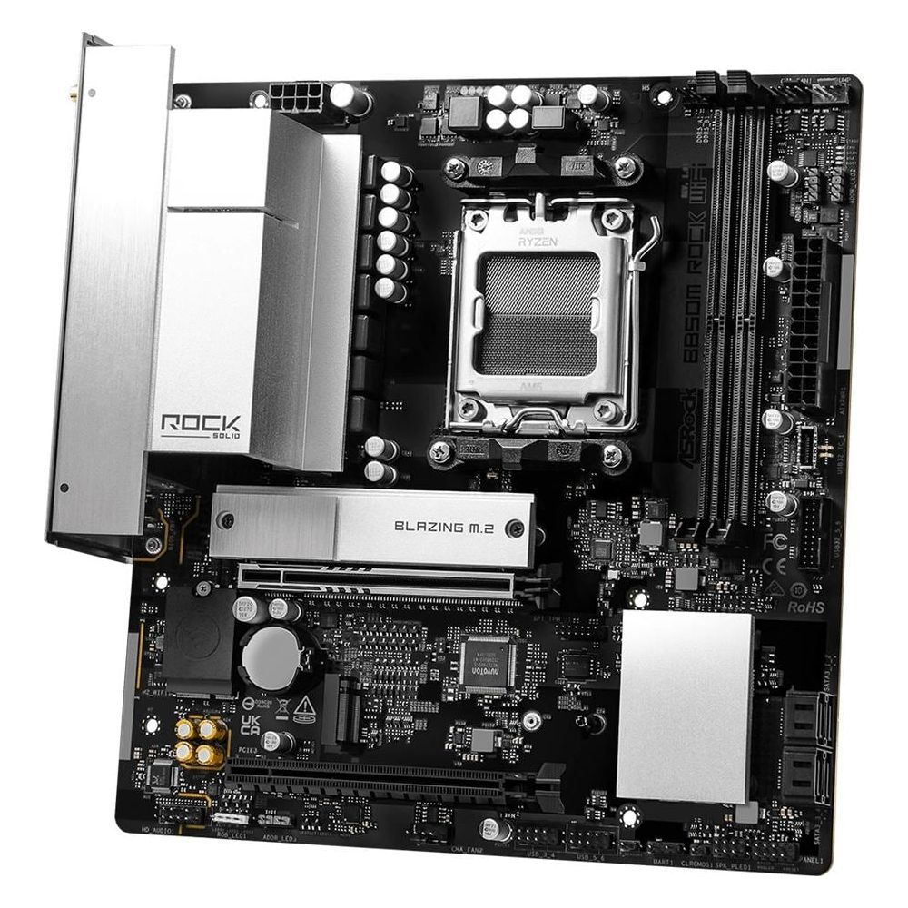 Une carte mère ASRock noire avec dissipateurs argentés et socket CPU Ryzen.