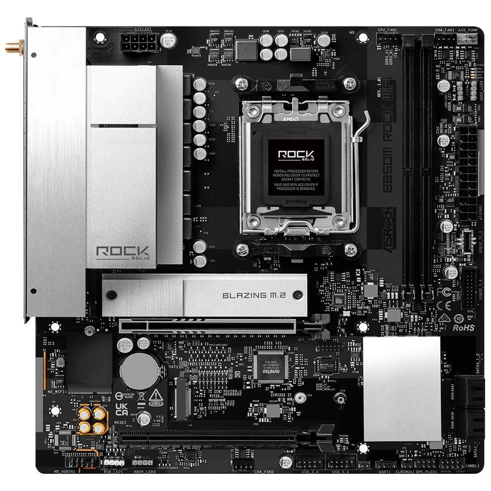 Une carte mère noire avec des dissipateurs argentés et un socket CPU.