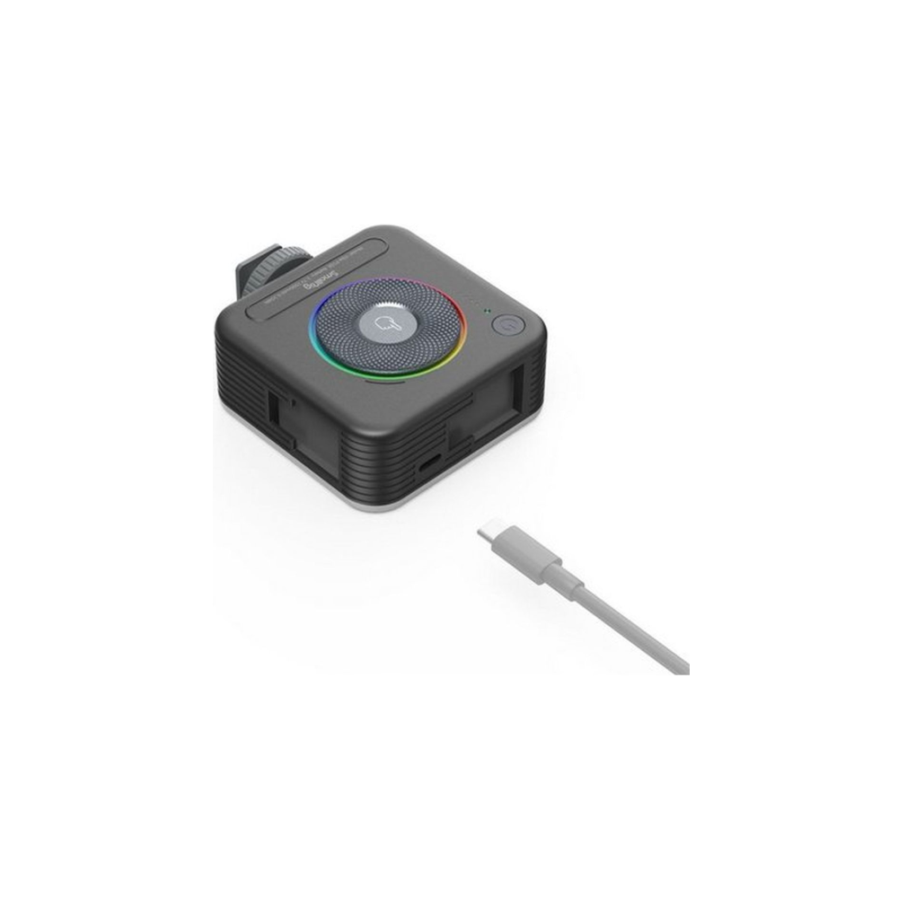 Een zwart lichtapparaat met een USB-C kabel ernaast.