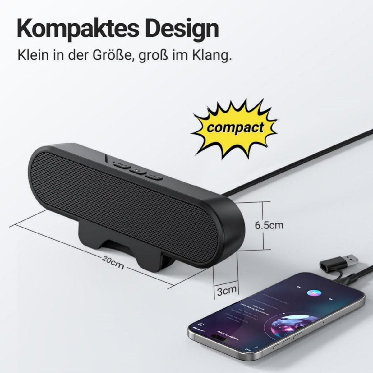 Schwarzer kompakter Lautsprecher (20x6.5x3cm) mit einem Handy verbunden.