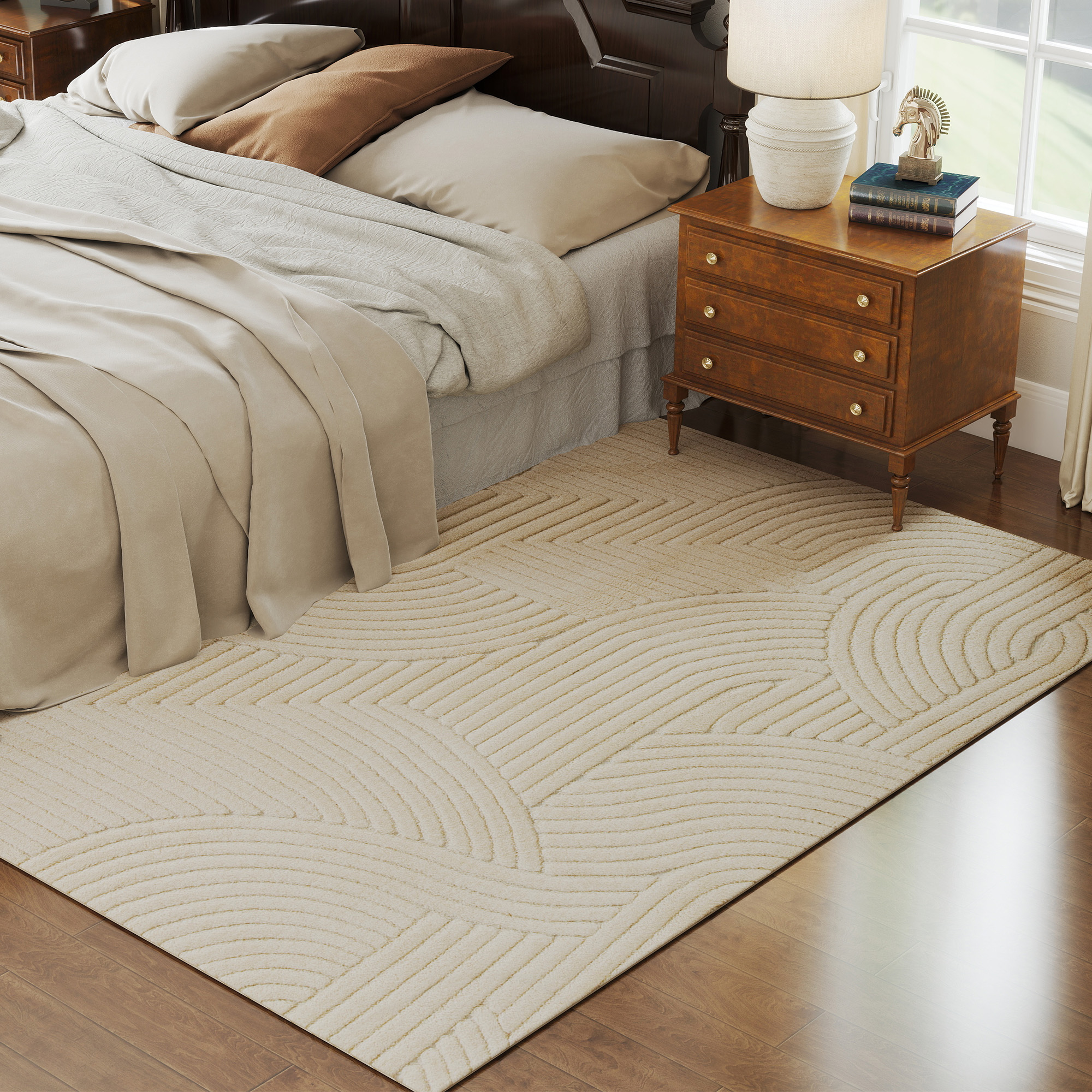 Un dormitorio con alfombra de patrón geométrico y mesita de noche.