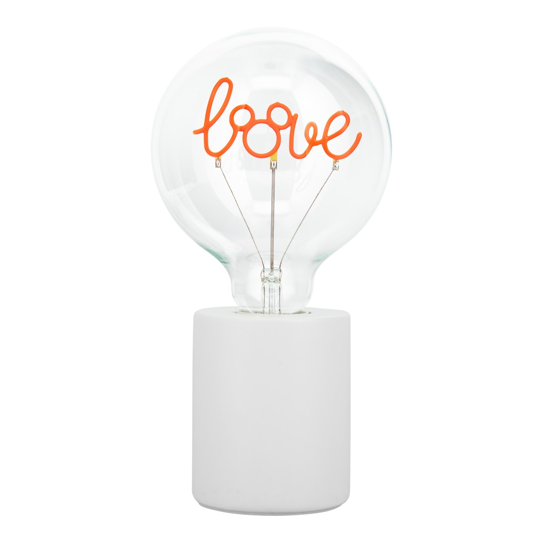 Una lampadina trasparente con la scritta 'love' in corsivo arancione su base bianca.
