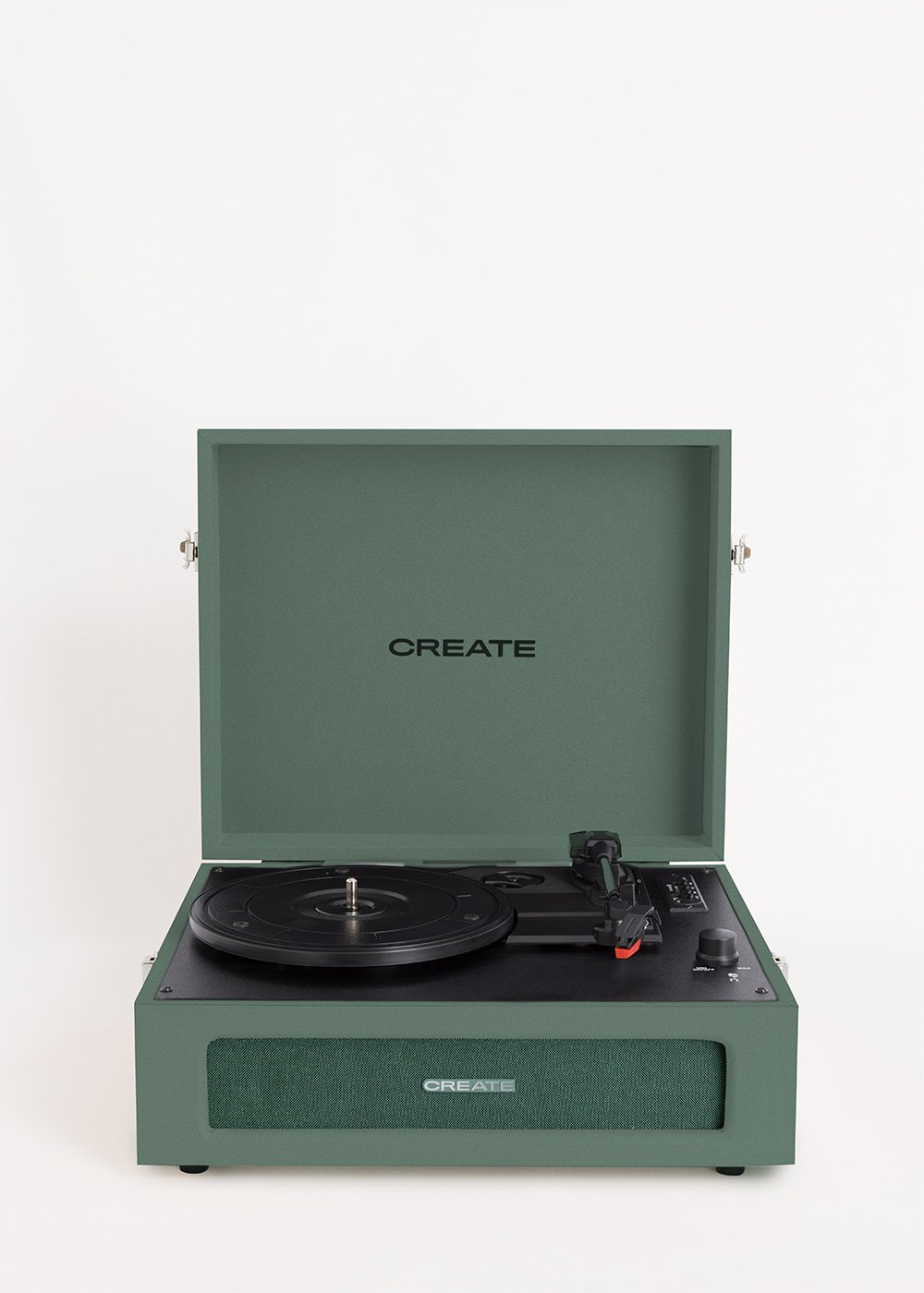 Un tocadiscos verde con la tapa abierta, mostrando la palabra CREATE.