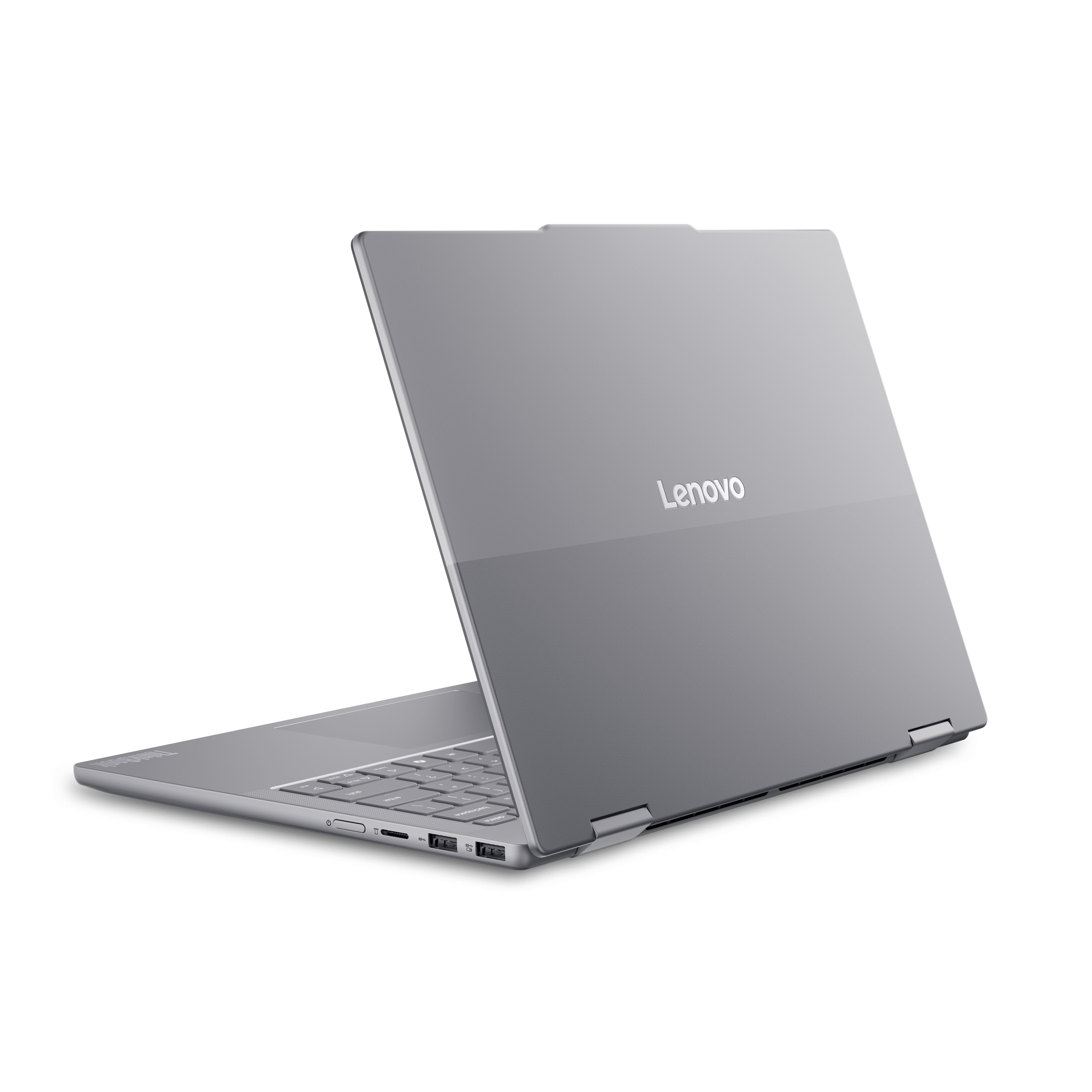 Un portátil Lenovo plateado, parcialmente abierto, mostrando el teclado y los puertos.