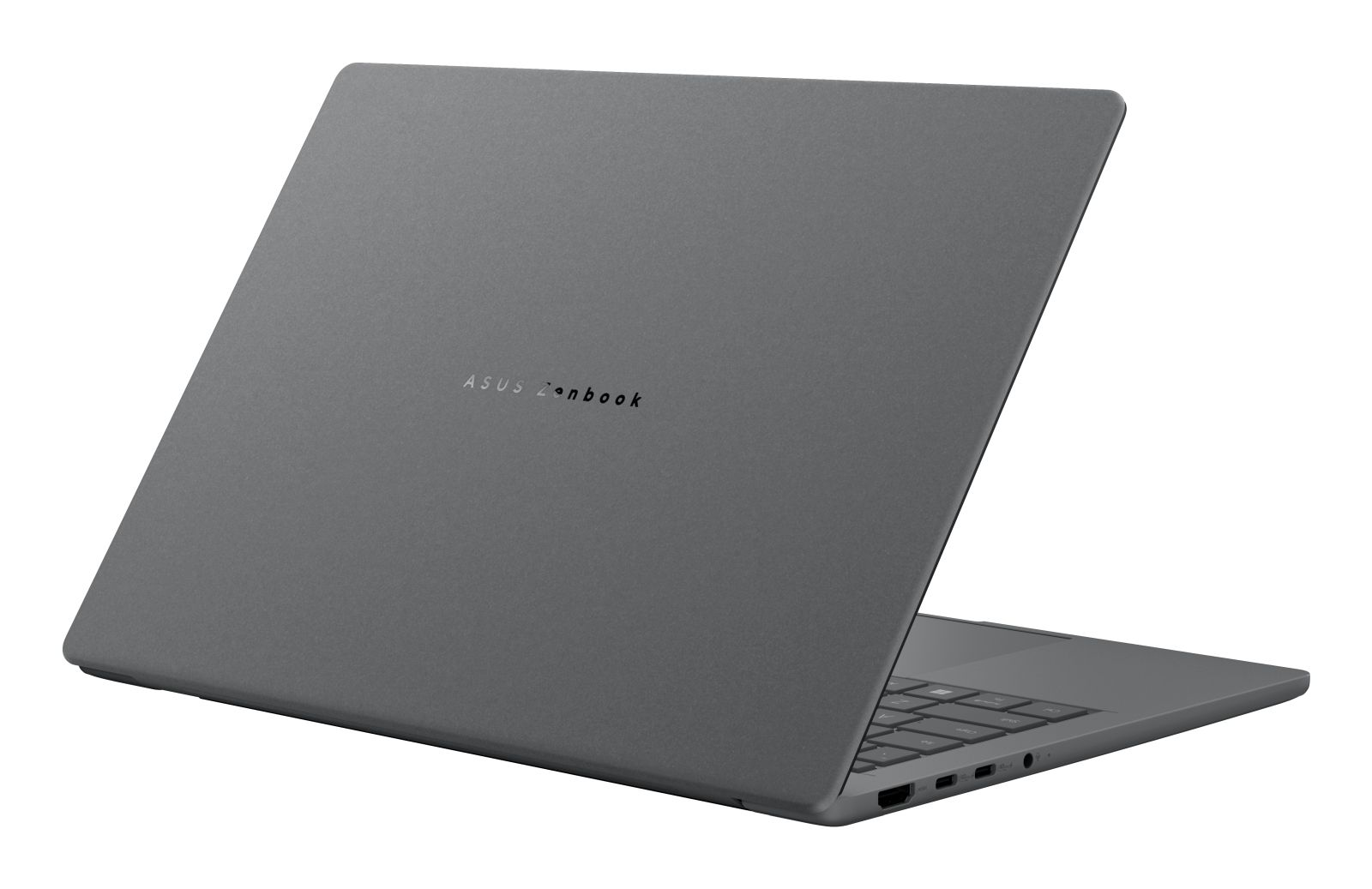 Un portátil gris cerrado con el logo de ASUS Zenbook en la tapa.