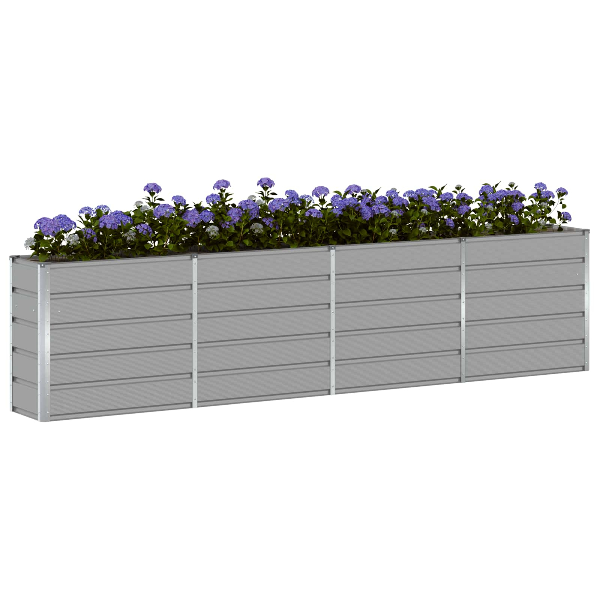 Una lunga fioriera rialzata grigia riempita di ortensie blu e foglie verdi.