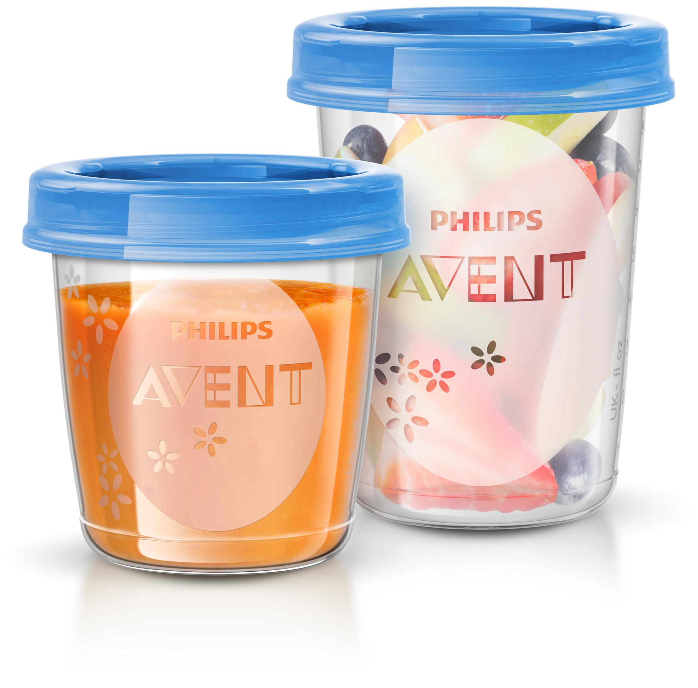 Zwei Philips Avent Behälter mit blauen Deckeln. Einer enthält Orangepüree, der andere Obst.