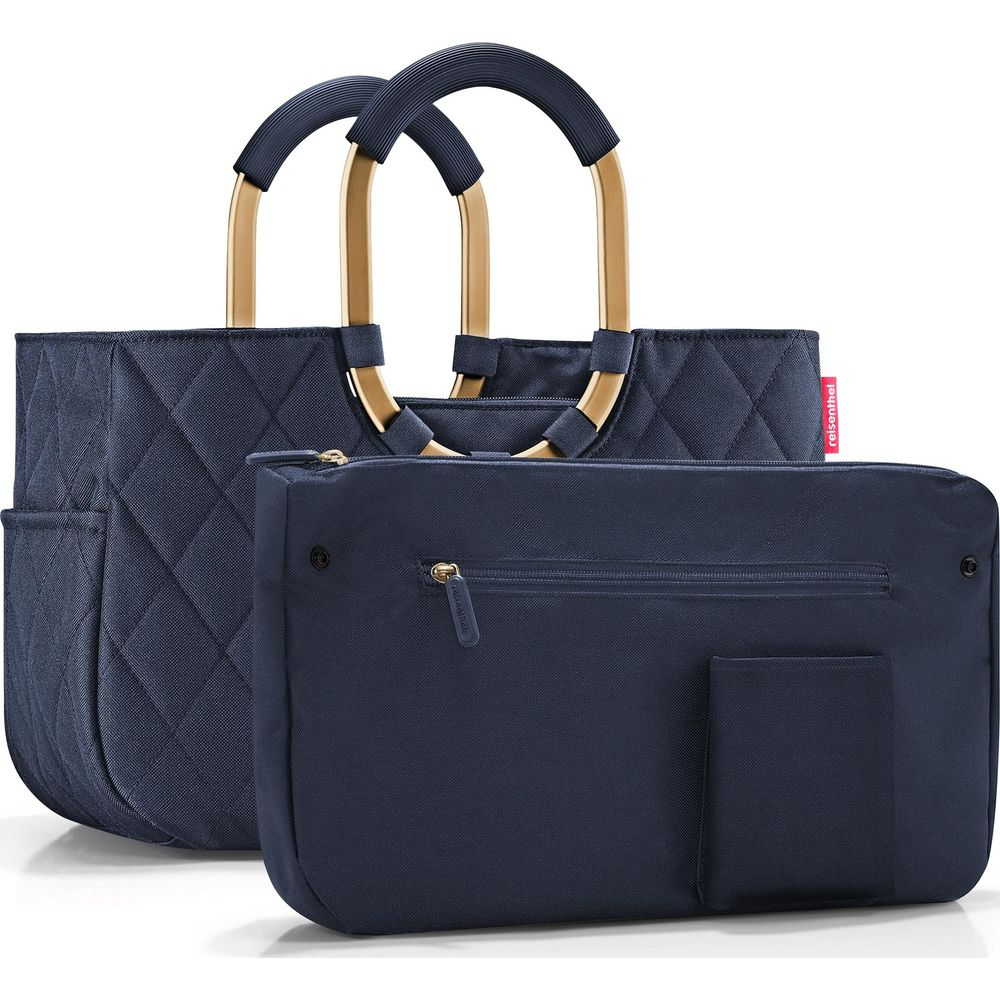 Dunkelblaue gesteppte Tasche mit goldenen Griffen und Reißverschlusstasche.