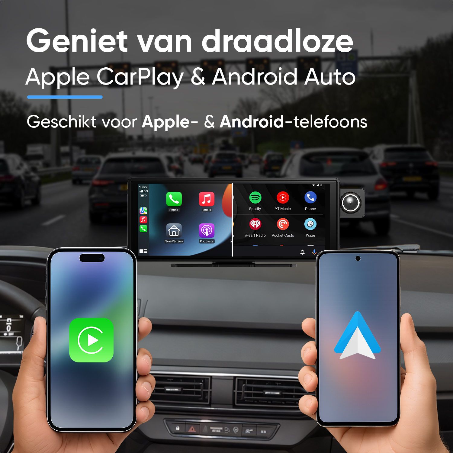 Two hands hold smartphones in front of a car infotainment screen while driving on a road.