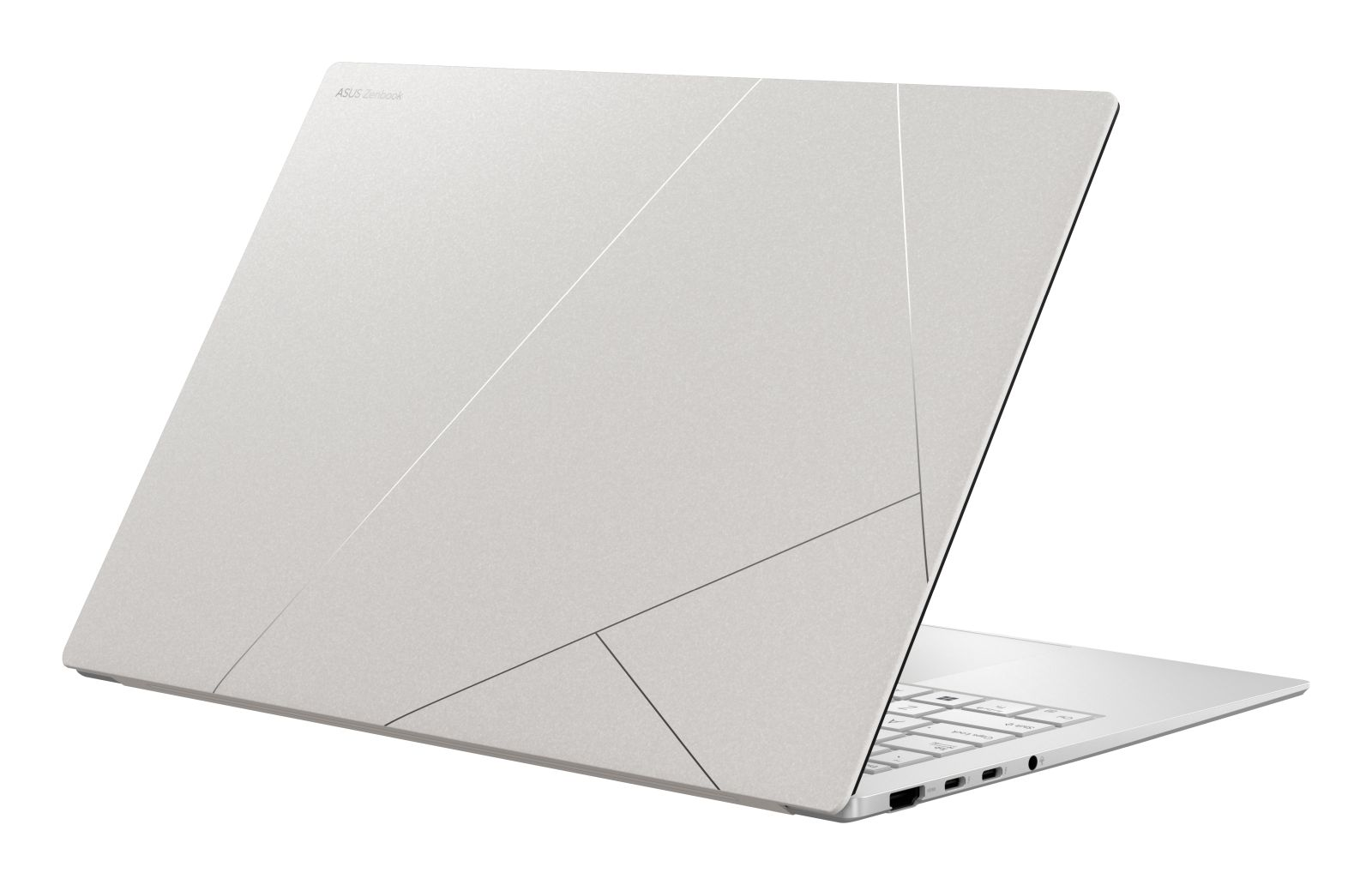 Ein silberner Laptop mit asymmetrischen Linien auf dem Deckel. Die Tastatur ist sichtbar.