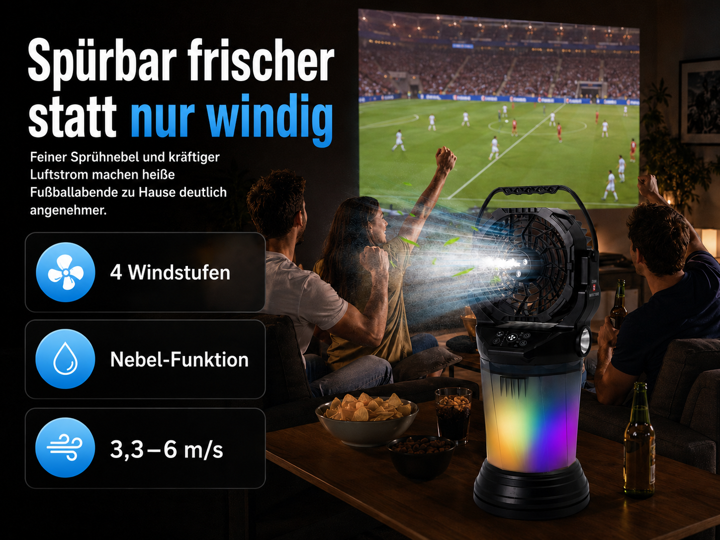 Ein Ventilator mit Nebelfunktion und bunten Lichtern kühlt drei Personen beim Fußballschauen.