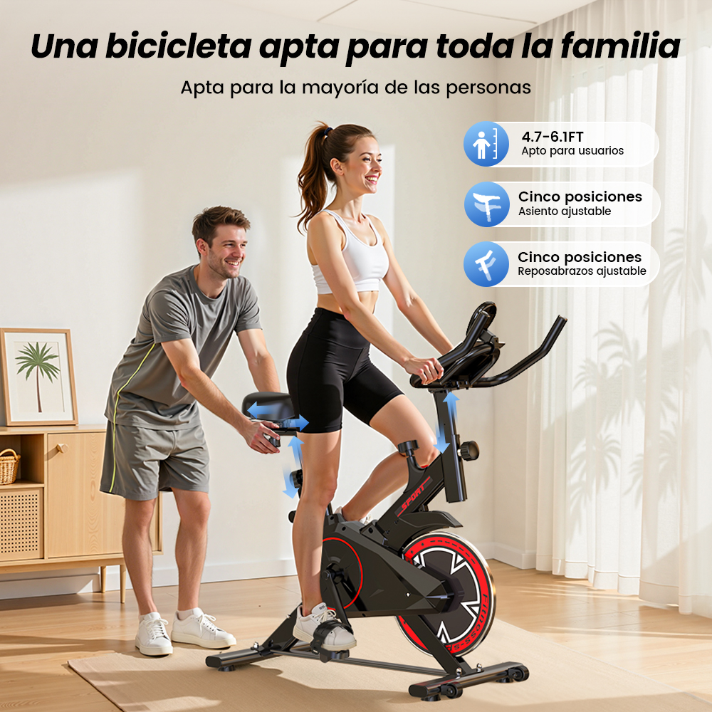 Un hombre ayuda a una mujer en una bicicleta estática, apta para toda la familia.