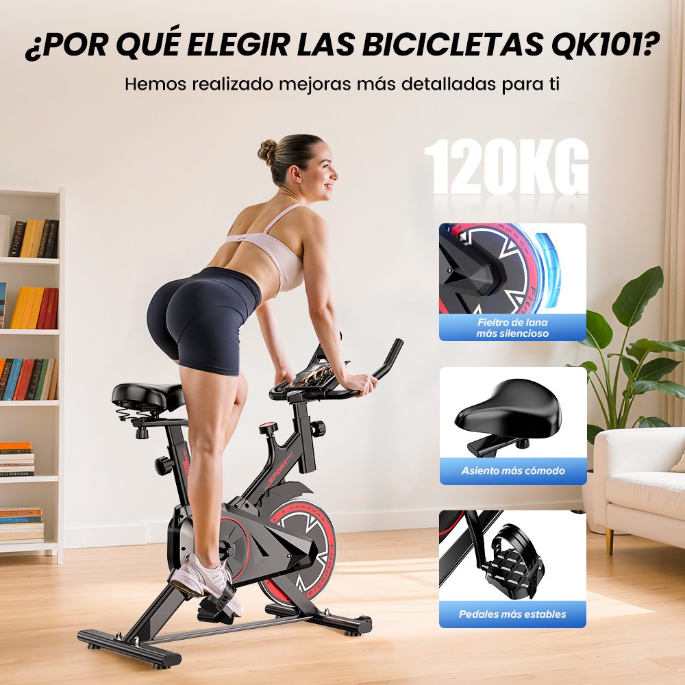 Una mujer en una bicicleta estática negra en una habitación luminosa con estanterías.