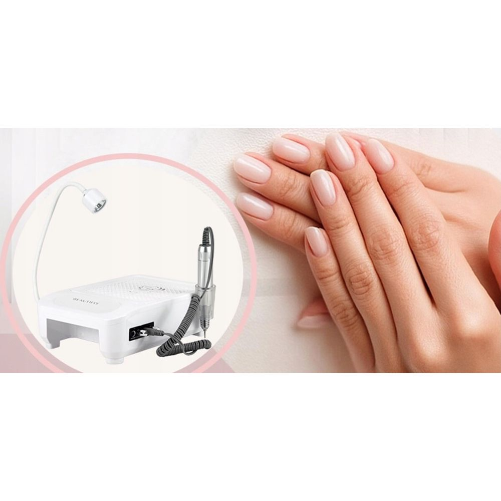 Una fresadora de uñas blanca con lámpara y uñas cuidadas.