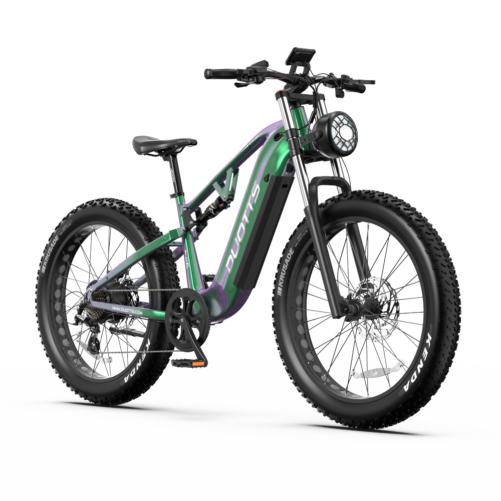 Zielono-fioletowy rower elektryczny fat bike z czarną ramą i dużymi oponami.