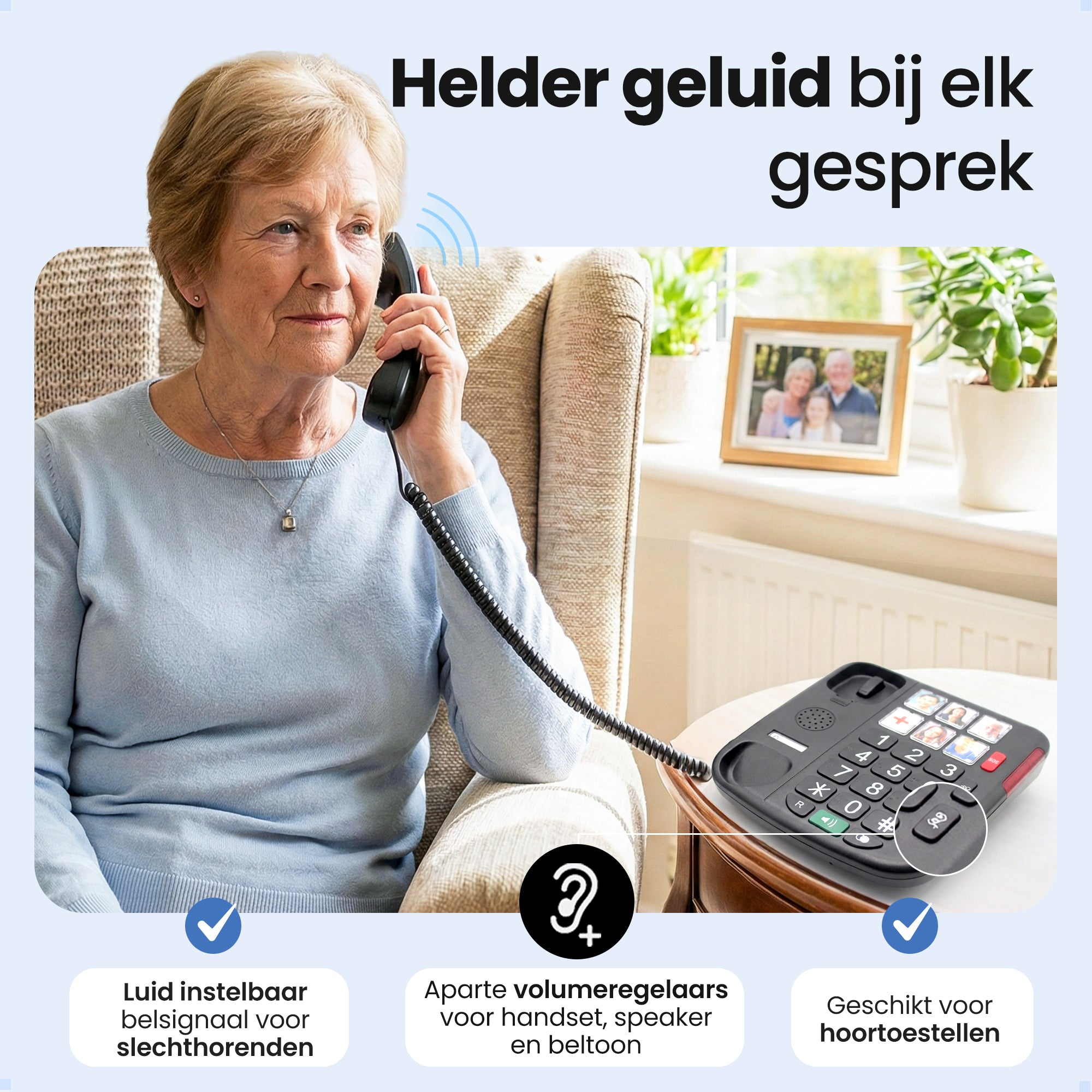 An elderly woman in a blue sweater is on the phone.