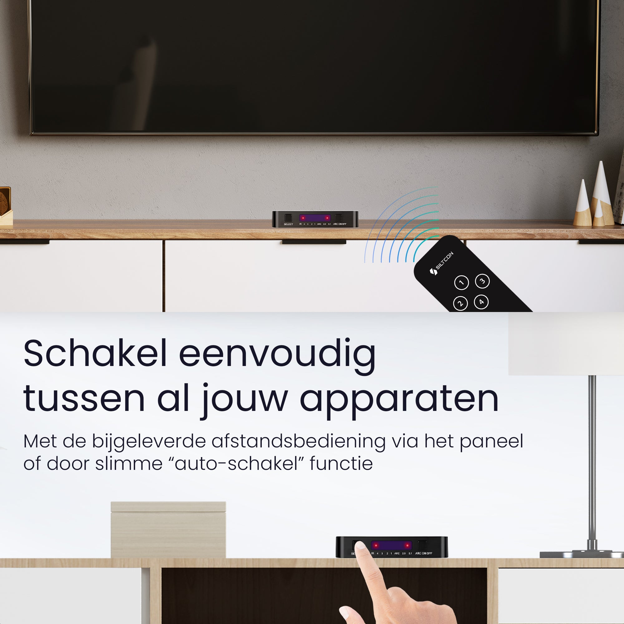 A black switcher device with a remote control in front of a TV.