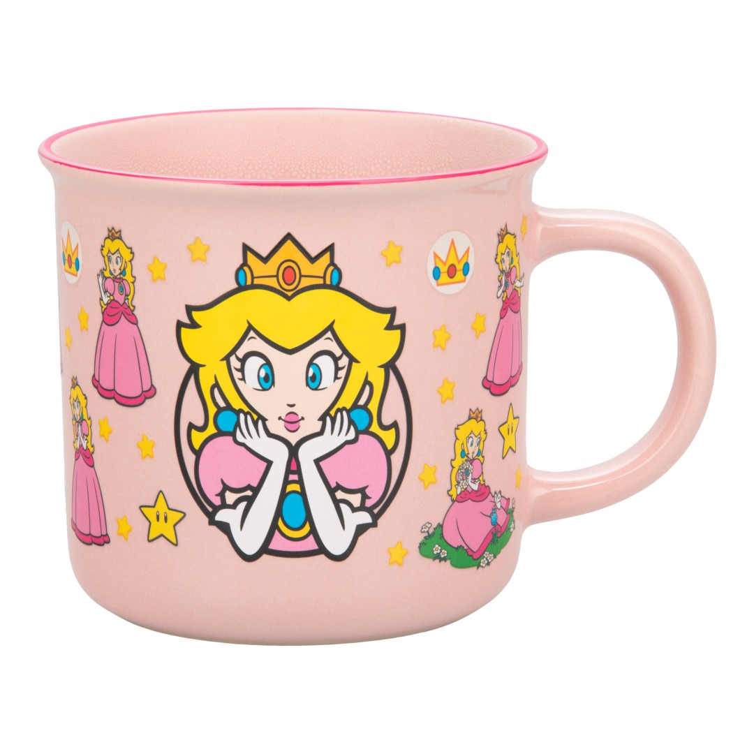 Różowy kubek ozdobiony wizerunkami Księżniczki Peach, gwiazd i koron.